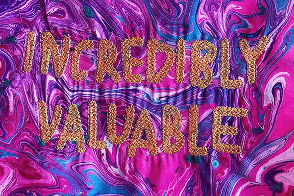 A series of small marbled and embroidered textiles by artist Kate Geck titled the fkn fine art textiles. These works are made by a real human, not a machine learning model, so they are guaranteed to be more valuable to collectors.