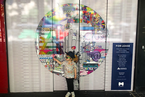 Kate Geck Picture Windows installation view of large vinyl wrapped shopfronts with embedded QR codes that link to a net art website.